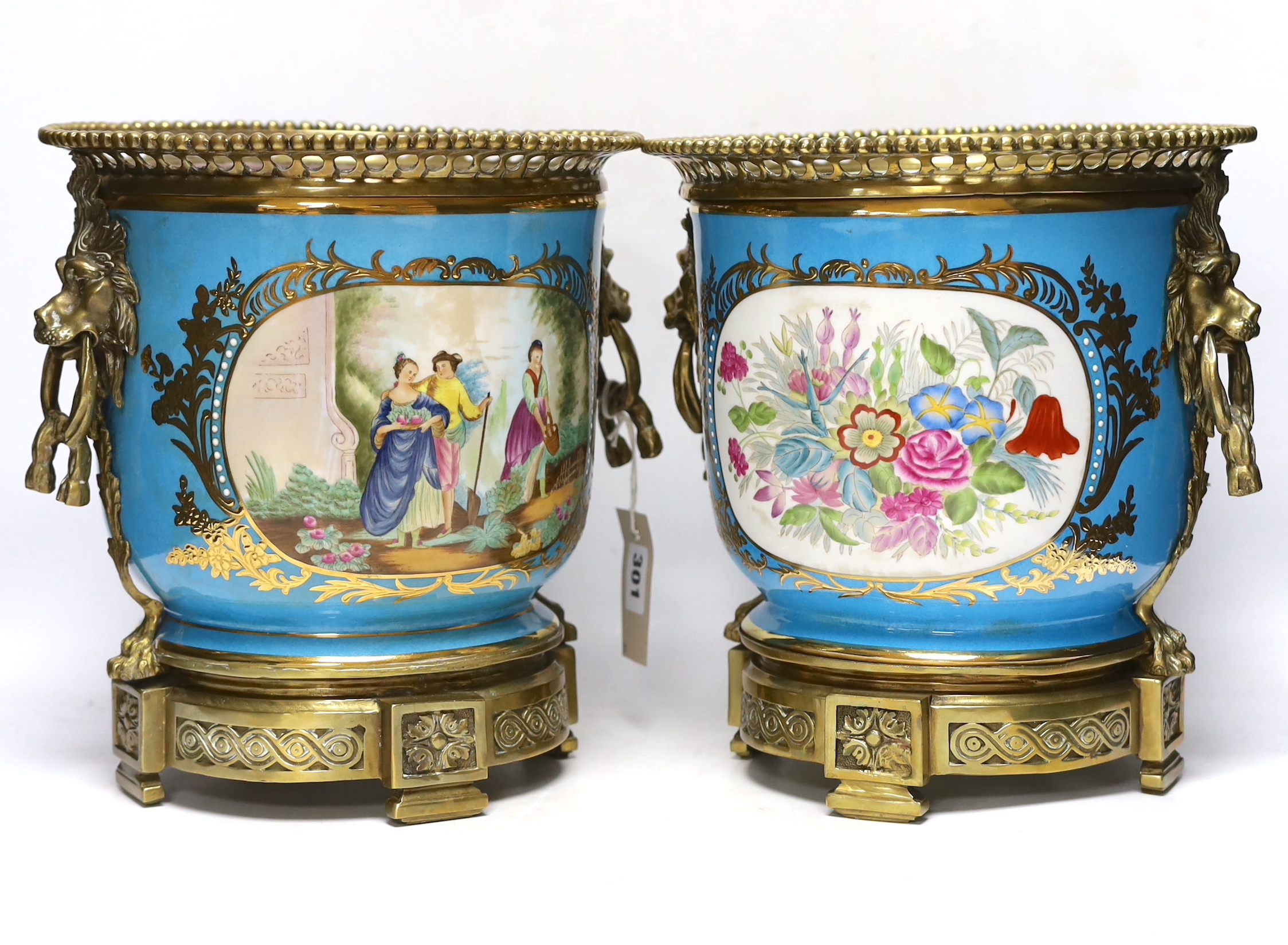 A pair of brass mounted Kusnetzoff style jardinières hand painted with figures, 28cm high